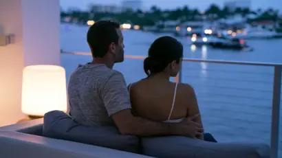 An interracial couple sitting together in a Fort Lauderdale condo having a reflective conversation